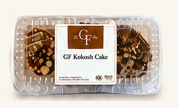 GF Kokosh Cake slices in a clear container with The GF Shop label